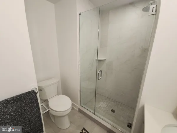 a bathroom with a toilet sink and vanity
