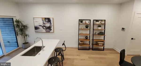 a view of a livingroom with furniture and closet