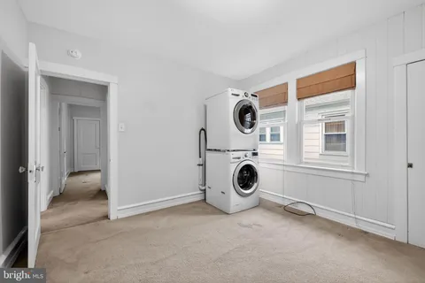 a view of a kitchen with a washer and dryer
