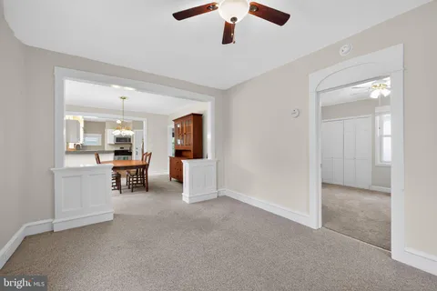 an empty room with furniture and a window