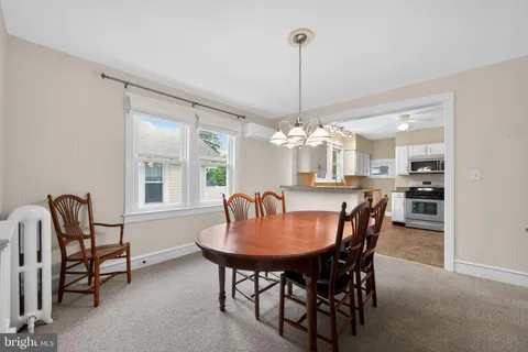 a view of a dining room with furniture window and outside view