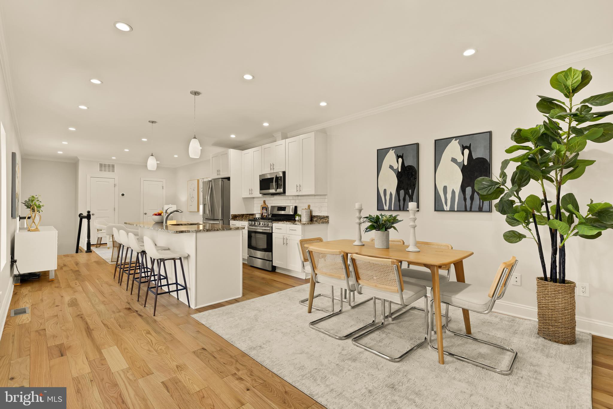 1671 Gales Street Northeast, Unit 1 Washington, DC 20002 - Photo 1 of 30 a view of a dining room with furniture