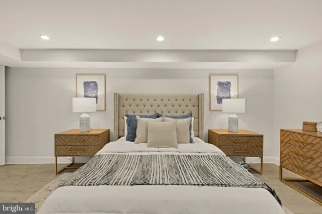 a bedroom with a bed and a couch