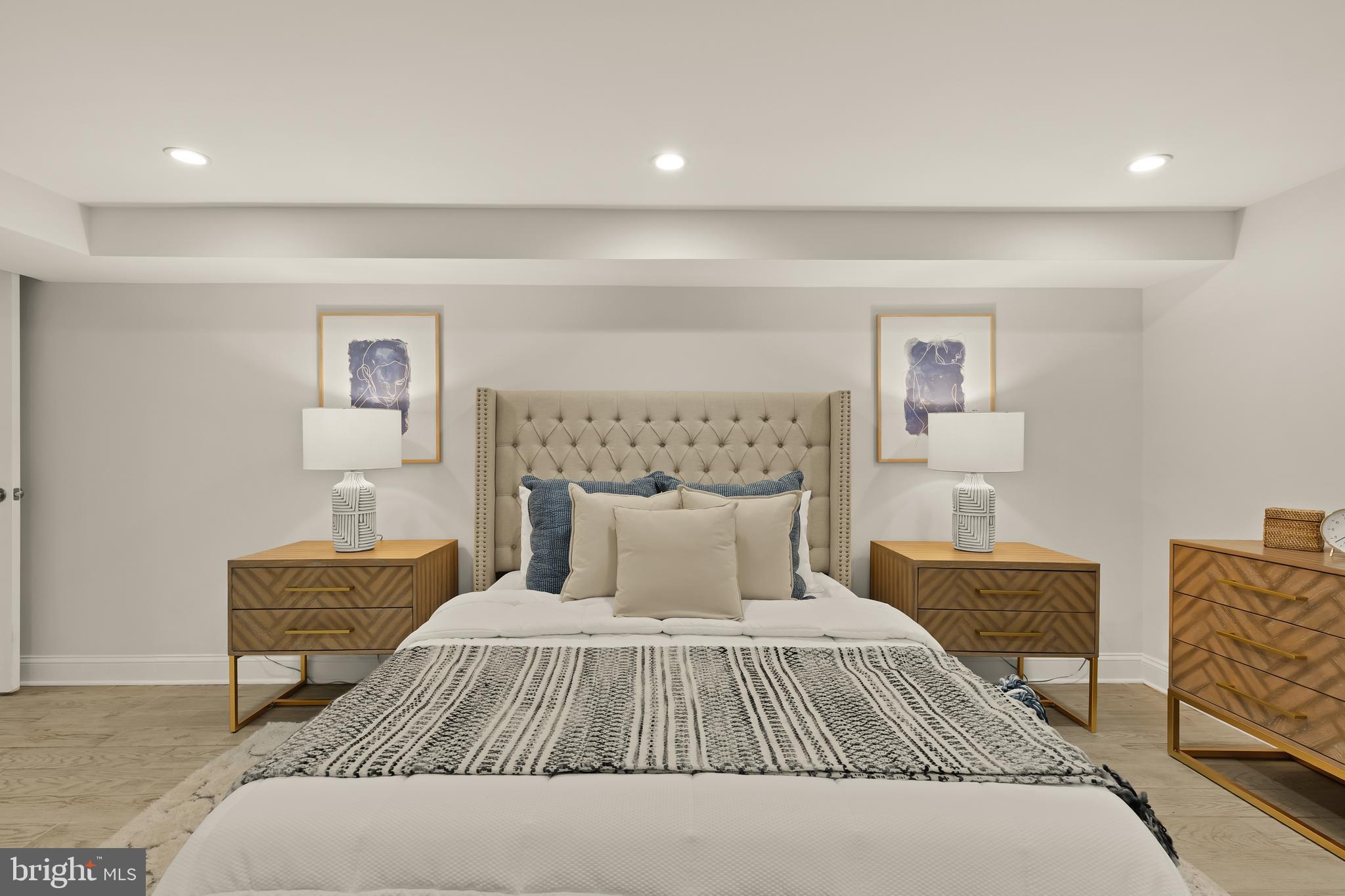 1671 Gales Street Northeast, Unit 1 Washington, DC 20002 - Photo 13 of 30 a bedroom with a bed and a couch