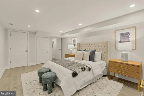 a bedroom with a bed and a lamp