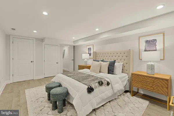 a bedroom with a bed and a lamp