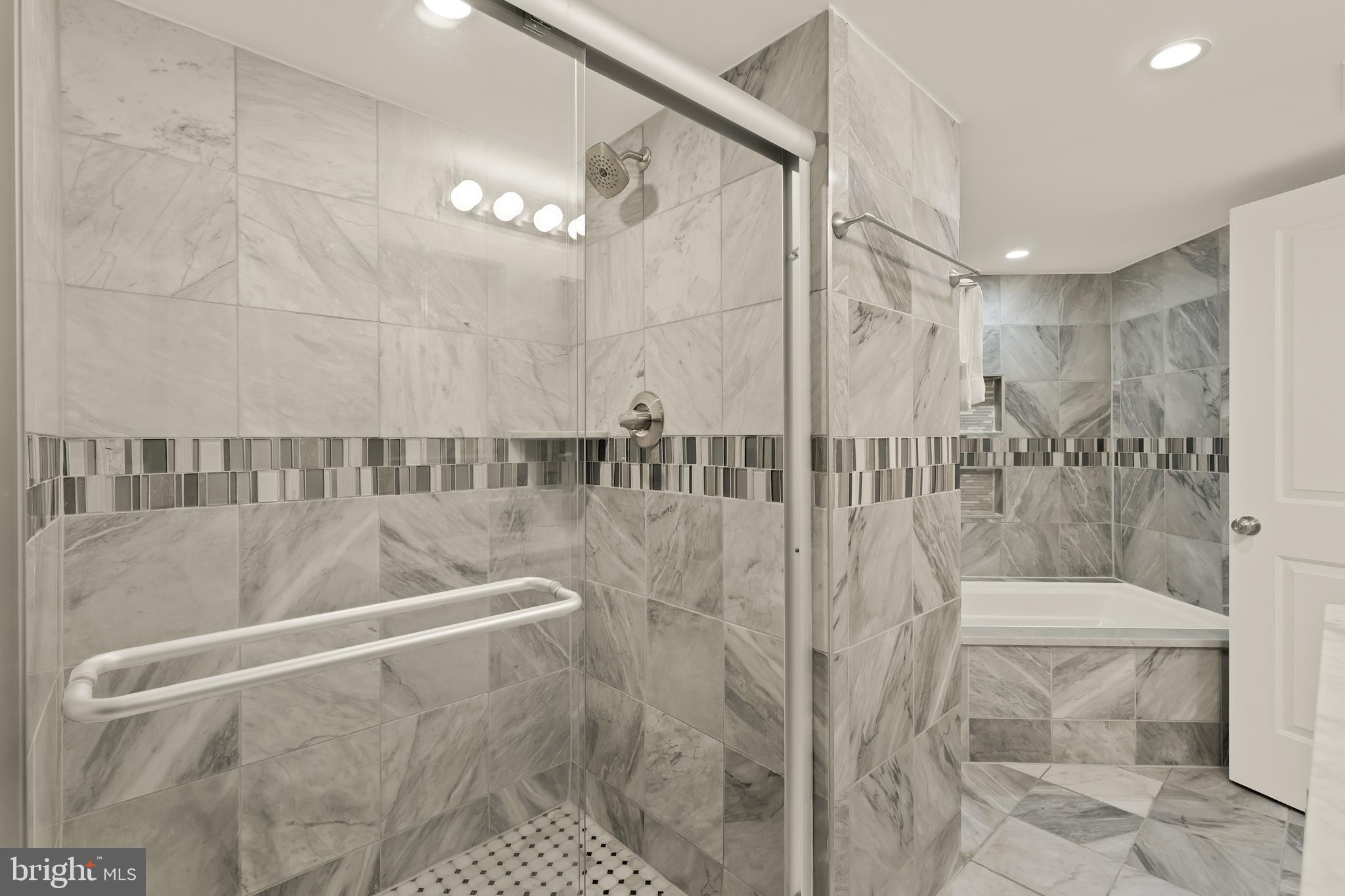 1671 Gales Street Northeast, Unit 1 Washington, DC 20002 - Photo 16 of 29 a bathroom with a shower a toilet and a shower