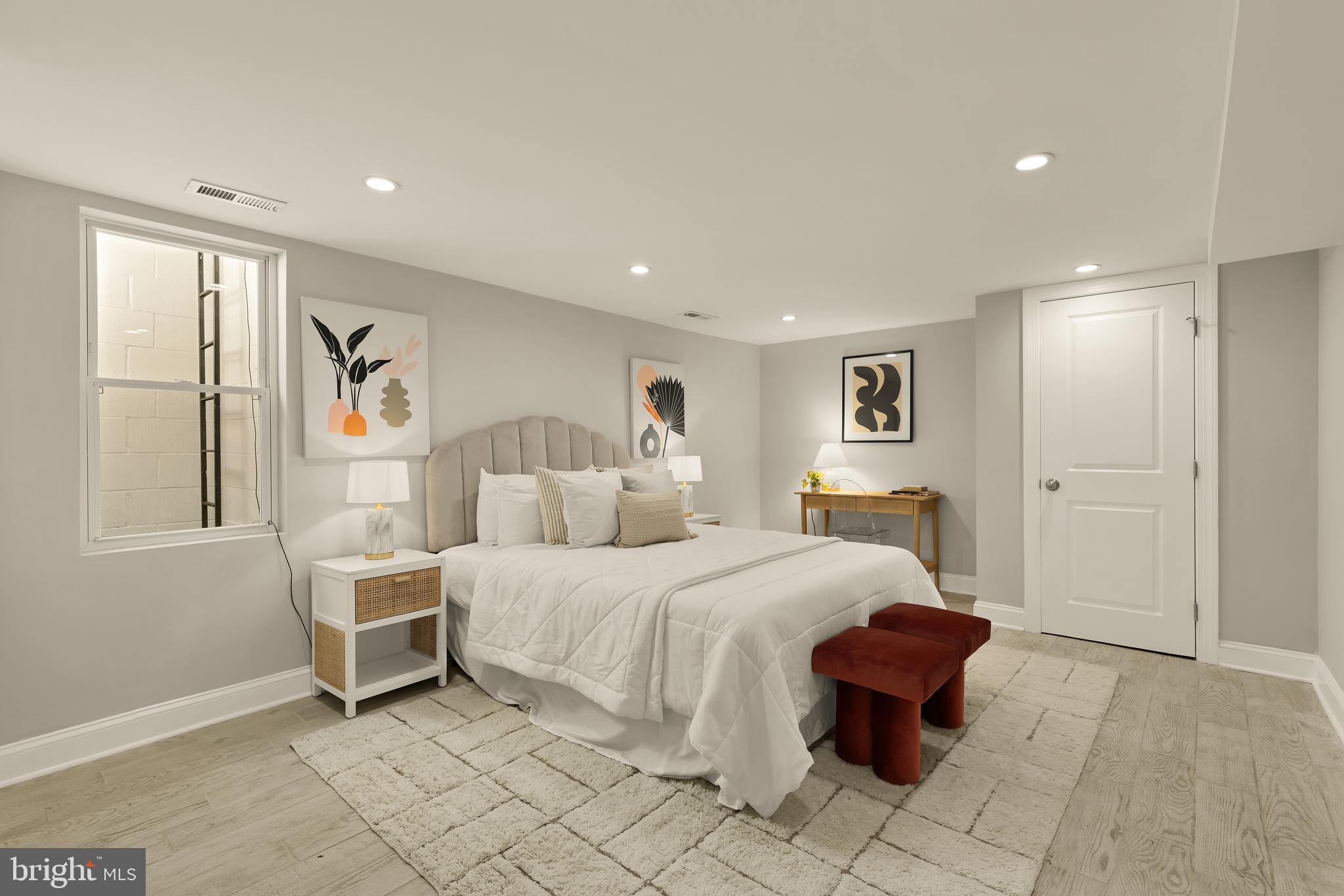 1671 Gales Street Northeast, Unit 1 Washington, DC 20002 - Photo 19 of 29 a bedroom with a large bed and a window