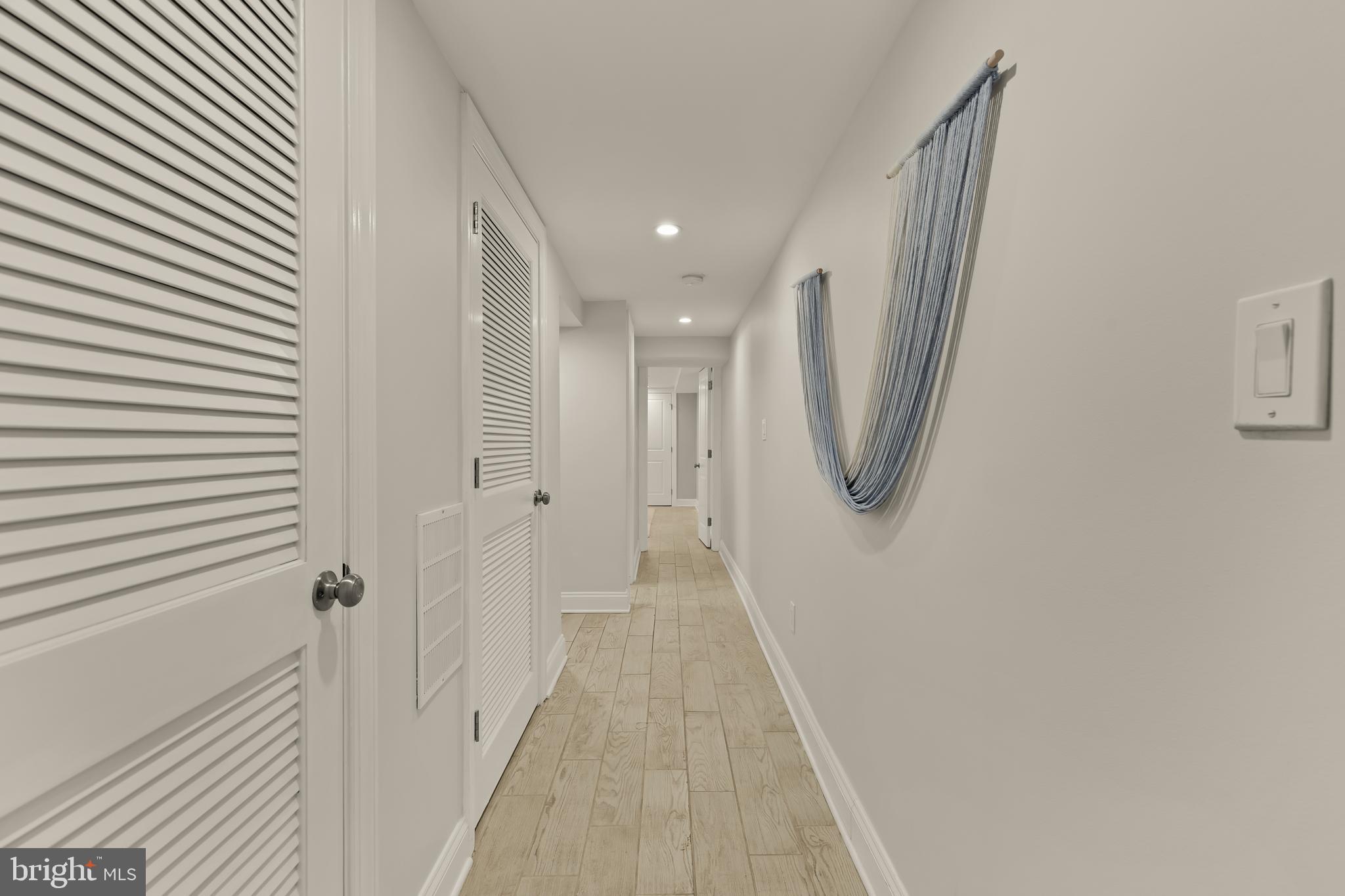 1671 Gales Street Northeast, Unit 1 Washington, DC 20002 - Photo 19 of 30 a view of a hallway with wooden floor and staircase