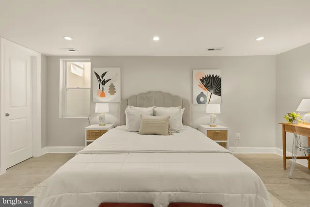 a large white bed in a white room