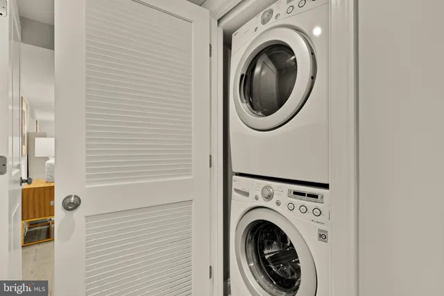 a view of a hallway with washer and dryer