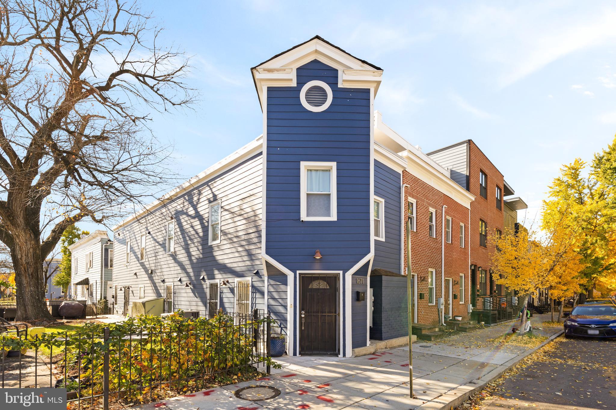 1671 Gales Street Northeast, Unit 1 Washington, DC 20002 - Photo 25 of 30 a front view of a building with trees
