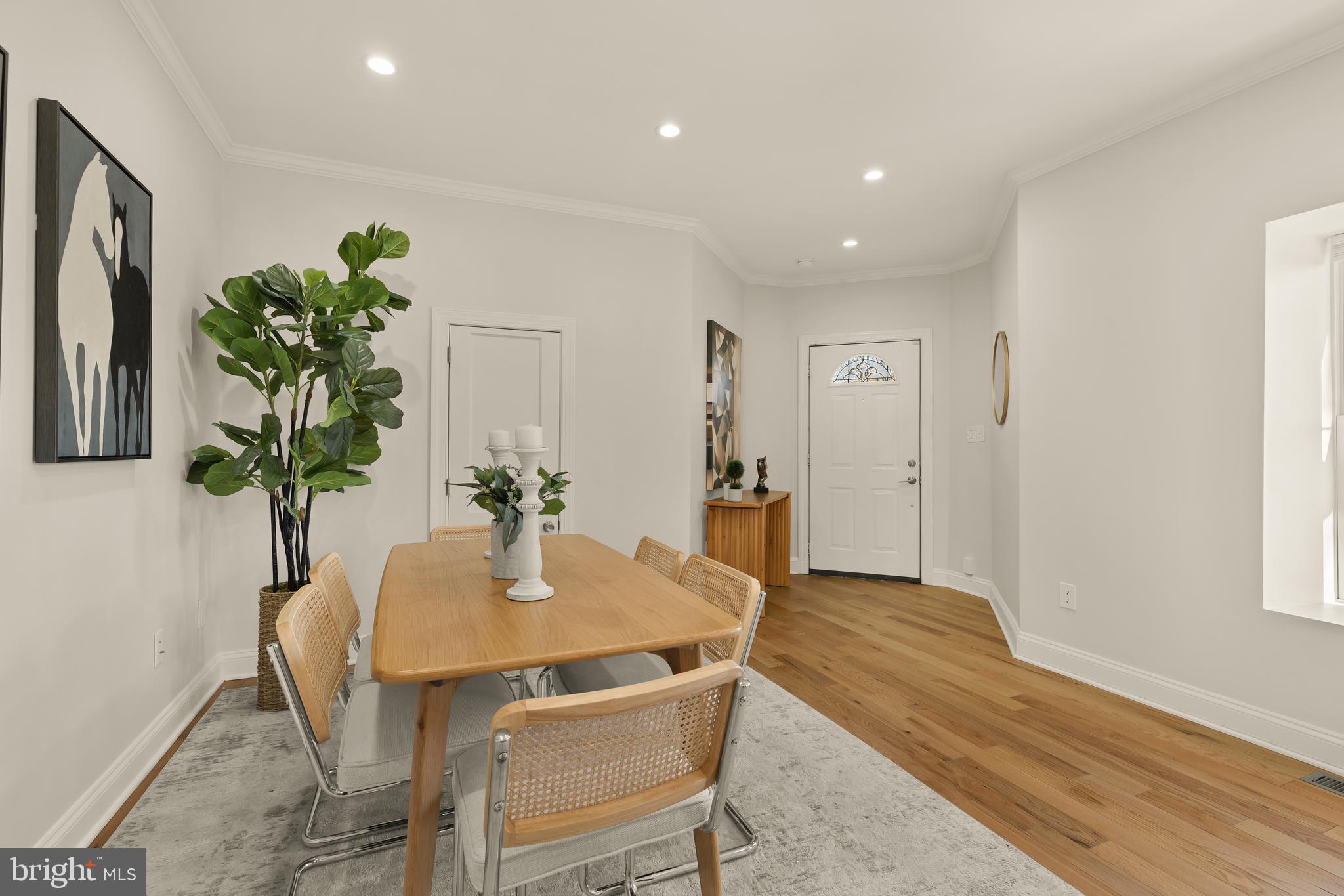 1671 Gales Street Northeast, Unit 1 Washington, DC 20002 - Photo 3 of 30 a dining room with furniture and wooden floor