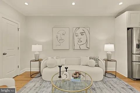 a living room with furniture and a table