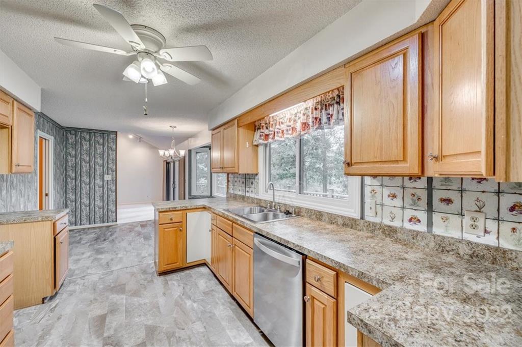 6036 Agate Court Tega Cay, SC 29708 - Photo 12 of 44 a large white kitchen with a large window