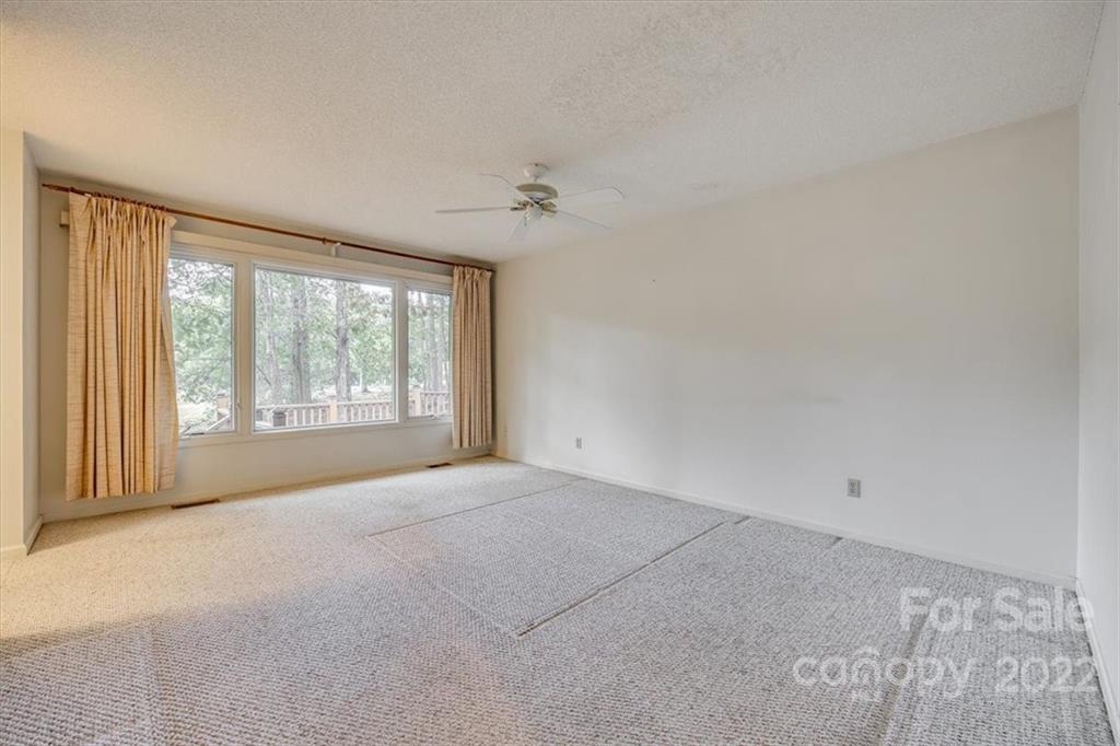 6036 Agate Court Tega Cay, SC 29708 - Photo 14 of 44 an empty room with windows