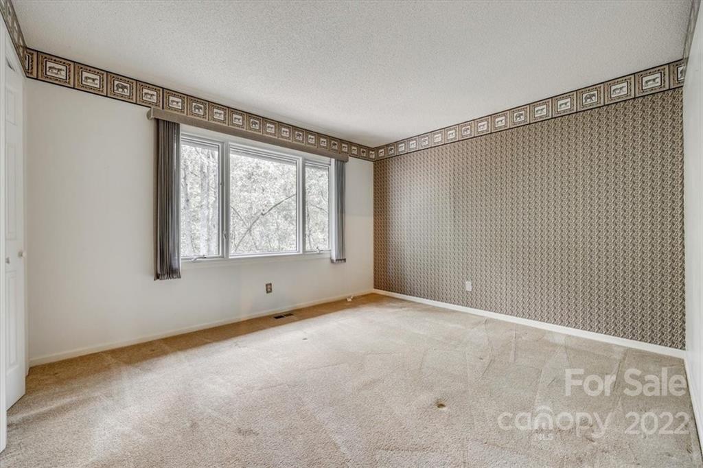 6036 Agate Court Tega Cay, SC 29708 - Photo 19 of 44 a view of an empty room with a window