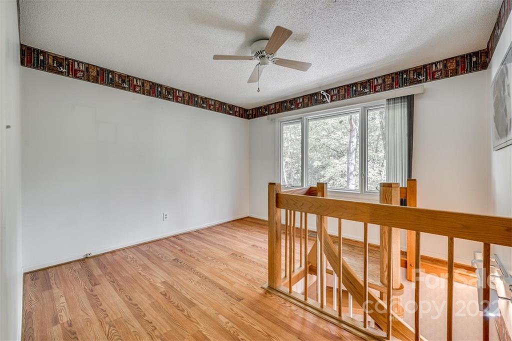 6036 Agate Court Tega Cay, SC 29708 - Photo 22 of 44 a view of a porch with a table and a ceiling fan
