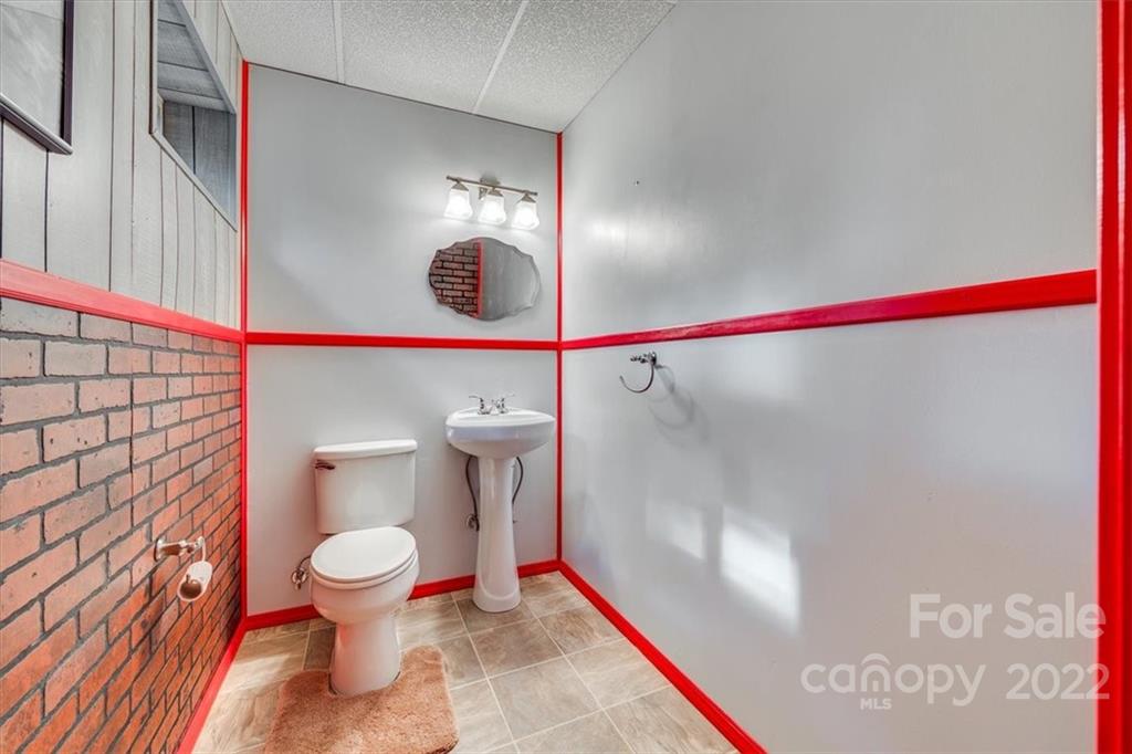 6036 Agate Court Tega Cay, SC 29708 - Photo 27 of 44 a bathroom with a toilet and a shower