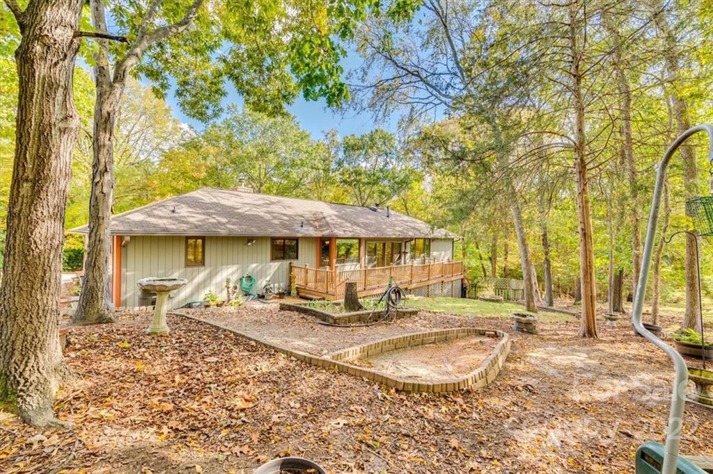 6036 Agate Court Tega Cay, SC 29708 - Photo 36 of 44 a backyard of a house with barbeque oven