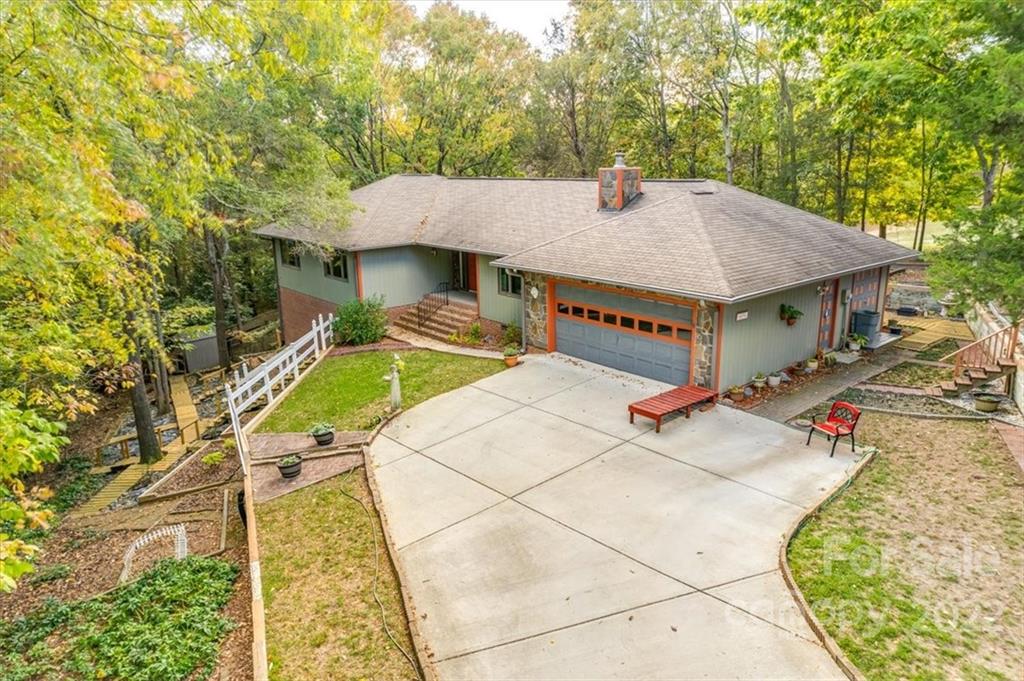 6036 Agate Court Tega Cay, SC 29708 - Photo 40 of 44 a view of a patio with a table and chairs