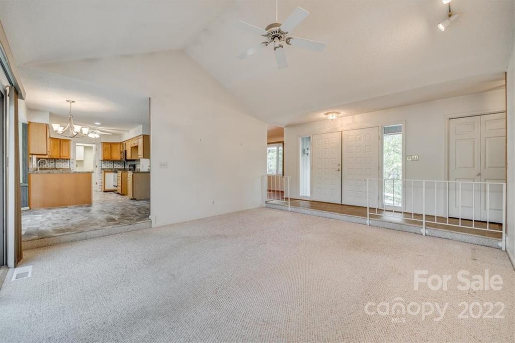 6036 Agate Court Tega Cay, SC 29708 - Photo 6 of 44 a view of empty room with a kitchen