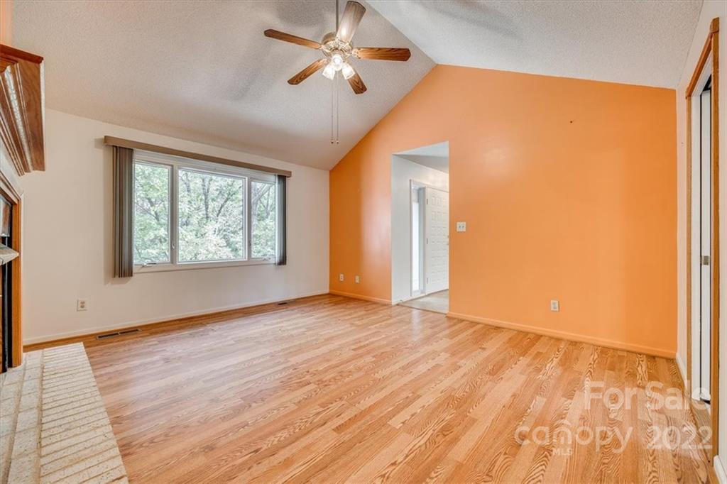 6036 Agate Court Tega Cay, SC 29708 - Photo 8 of 44 a view of empty room with wooden floor and fan