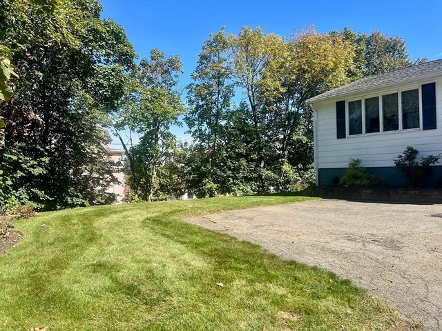 a view of a backyard of the house