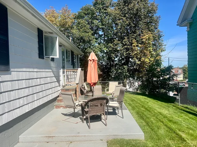 a view of backyard with sitting area
