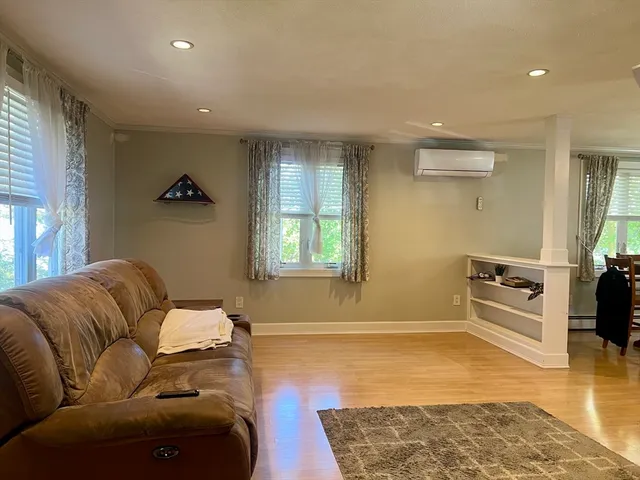 a living room with furniture and a rug