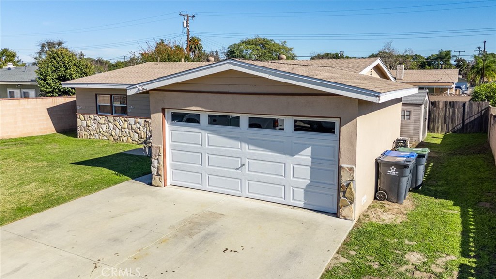 2309 Spinnaker Street Santa Ana, CA 92706 - Photo 4 of 9 a front view of a house with a yard