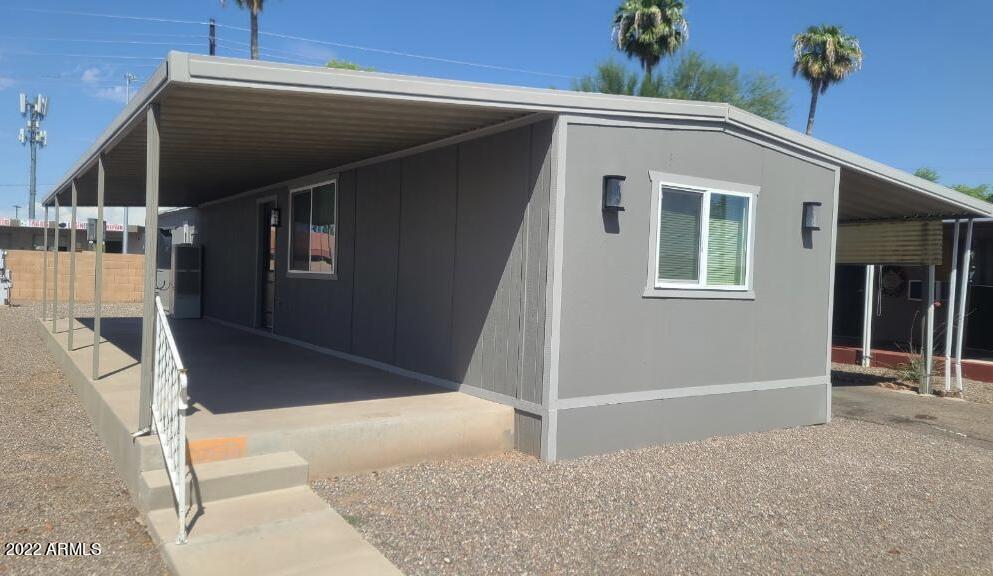 5201 West Camelback Road, Unit A7 Phoenix, AZ 85031 - Photo 1 of 22 a view of house with stairs and wooden floor