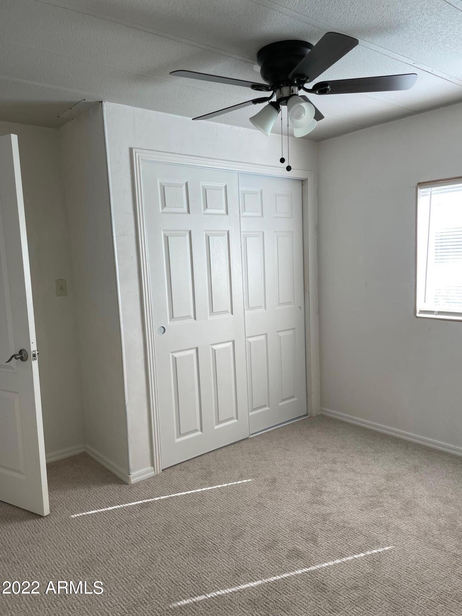 5201 West Camelback Road, Unit A7 Phoenix, AZ 85031 - Photo 15 of 22 a view of an empty room with a window