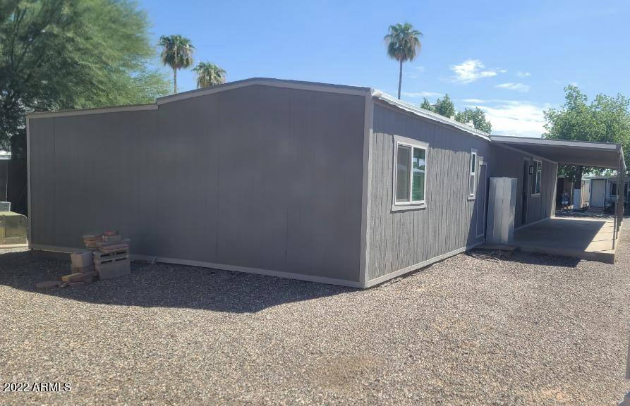 5201 West Camelback Road, Unit A7 Phoenix, AZ 85031 - Photo 2 of 22 a backyard of a house with table and chairs