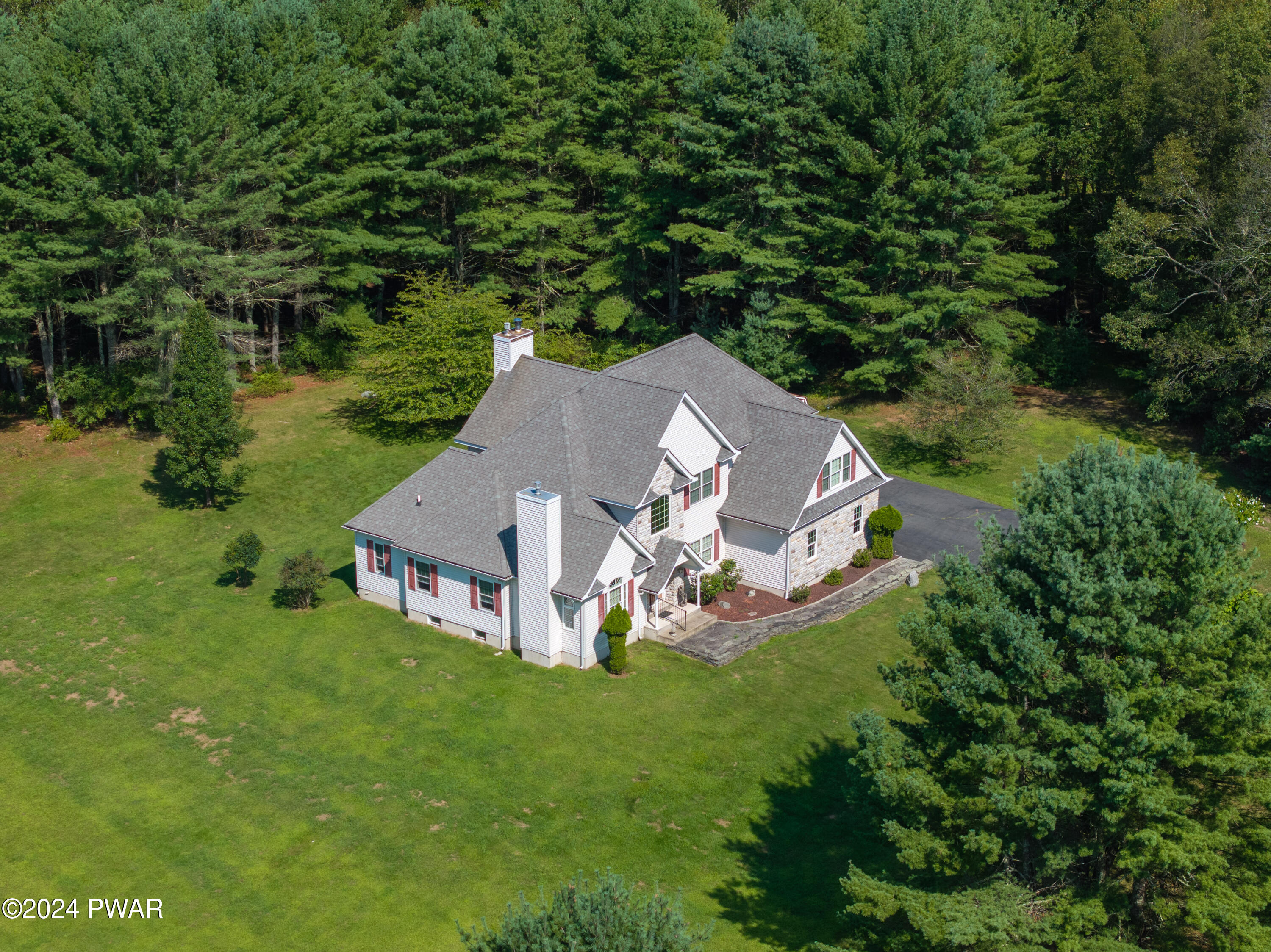 208 Long Meadow Road Milford, PA 18337 - Photo 59 of 64 a view of a house with a yard