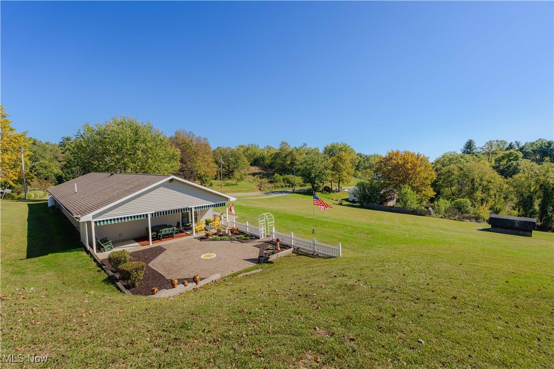 90480 Kilgore Ridge Road Scio, OH 43988 - Photo 26 of 39 View of green lawn featuring a patio area and view of wooded area