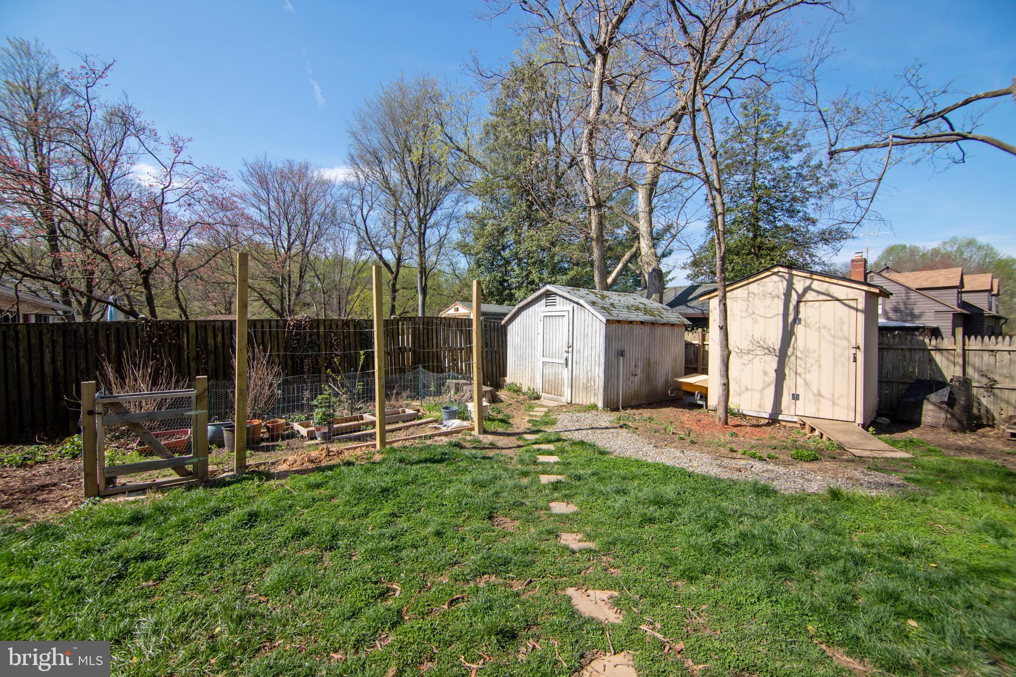 11324 Rambling Road Gaithersburg, MD 20879 - Photo 26 of 29 Fenced backyard with 3 sheds