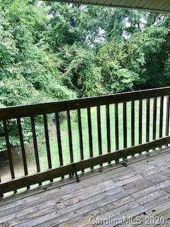 11048 Harrowfield Road Charlotte, NC 28226 - Photo 12 of 13 a view of wooden balcony and outdoor space
