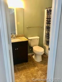 11048 Harrowfield Road Charlotte, NC 28226 - Photo 7 of 13 a bathroom with a sink toilet and shower