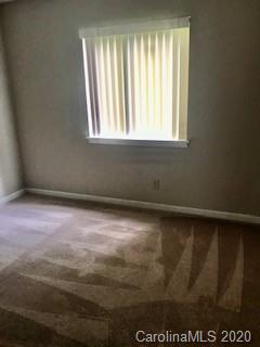11048 Harrowfield Road Charlotte, NC 28226 - Photo 8 of 13 an empty room with a window