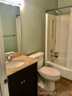11048 Harrowfield Road Charlotte, NC 28226 - Photo 9 of 13 a bathroom with a sink a toilet and shower
