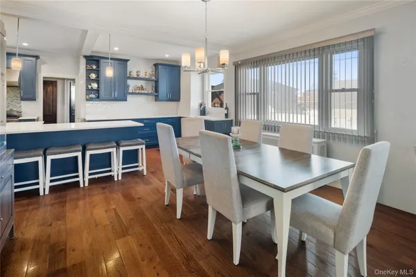 a dining room with furniture window wooden floor