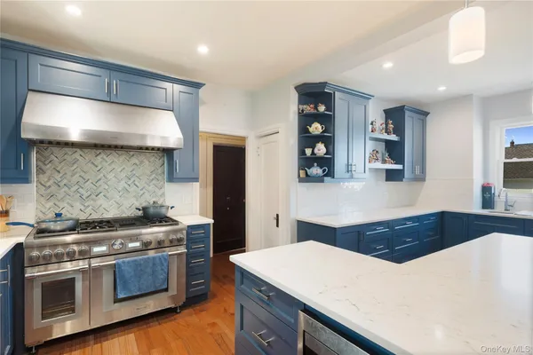 a kitchen with a stove and a refrigerator