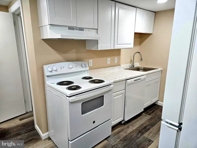 a kitchen with a stove and a sink