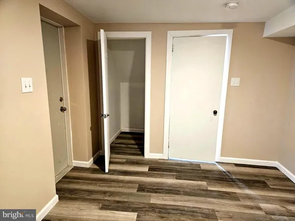 a view of entryway with wooden floor
