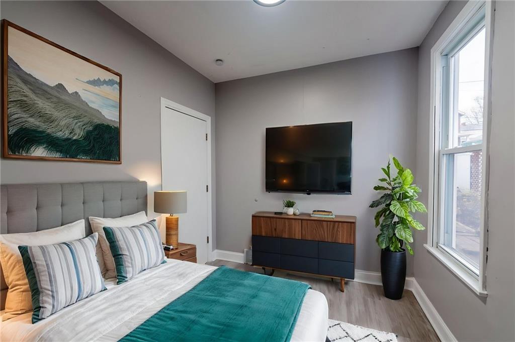 519 Lacock Street Rochester, PA 15074 - Photo 12 of 39 a living room with furniture and a flat screen tv