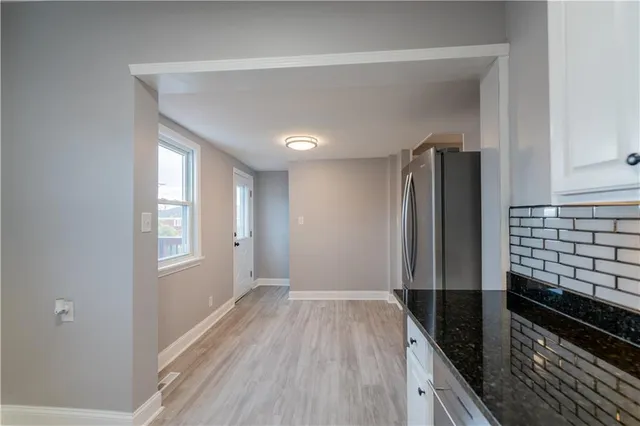 a view of a kitchen from the hallway