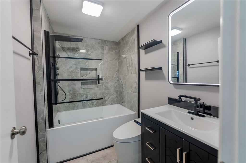 519 Lacock Street Rochester, PA 15074 - Photo 24 of 39 a bathroom with a granite countertop sink toilet and shower