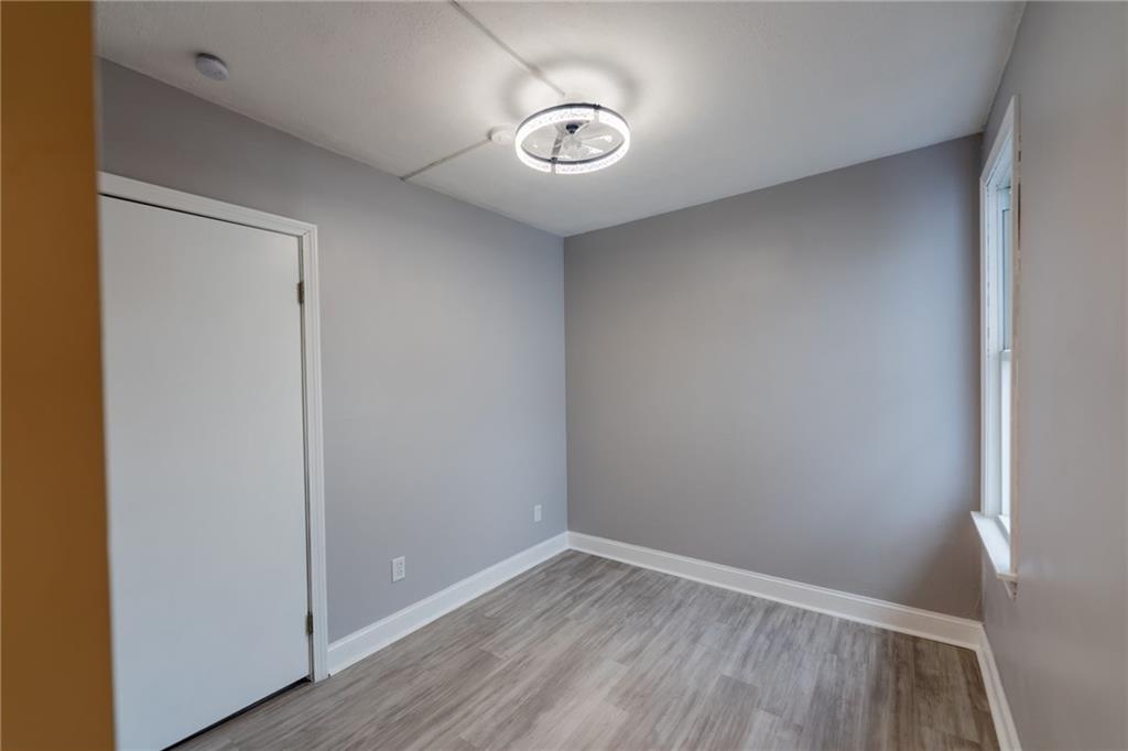 519 Lacock Street Rochester, PA 15074 - Photo 26 of 39 a view of empty room with wooden floor