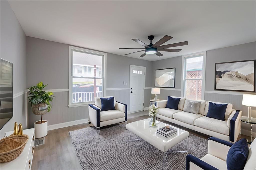 519 Lacock Street Rochester, PA 15074 - Photo 5 of 39 a living room with furniture and a large window